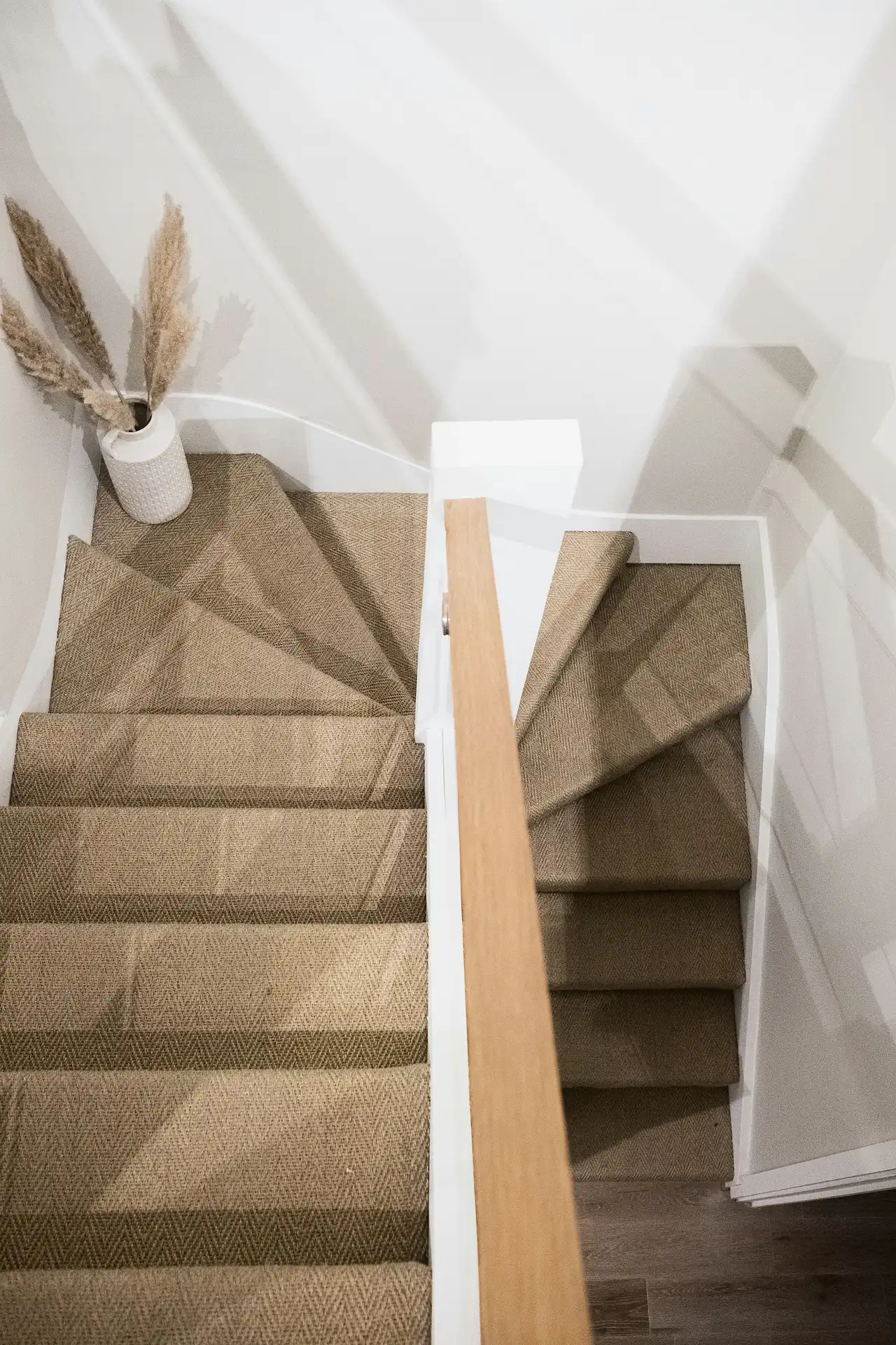 Hallway and stairs carpet showing perfect pile recovery after a commercial turnaround clean.